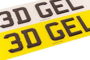 Pair of premium 3D gel number plates on a white square background